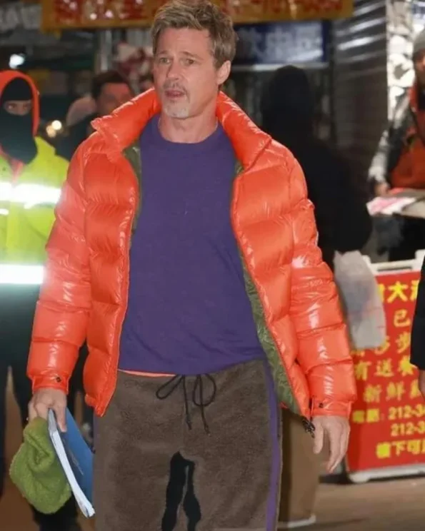 Wolfs-2024-Movie-Brad-Pitt-Orange-Jacket.webp